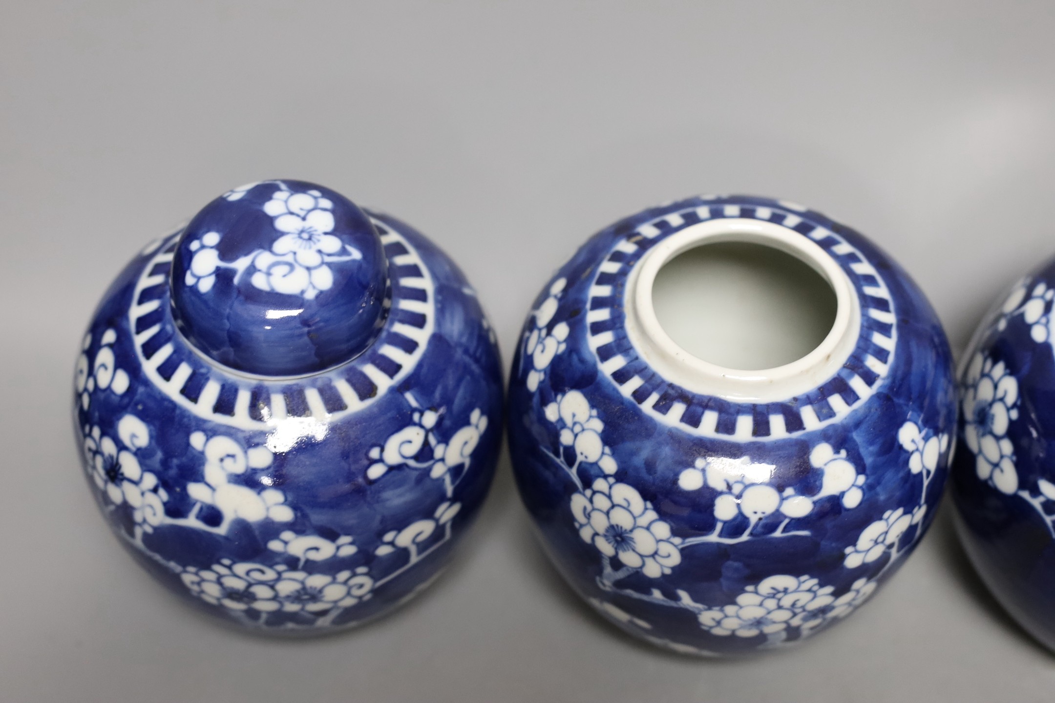 Four 19th / early 20th century Chinese blue and white prunus jars, 14cm